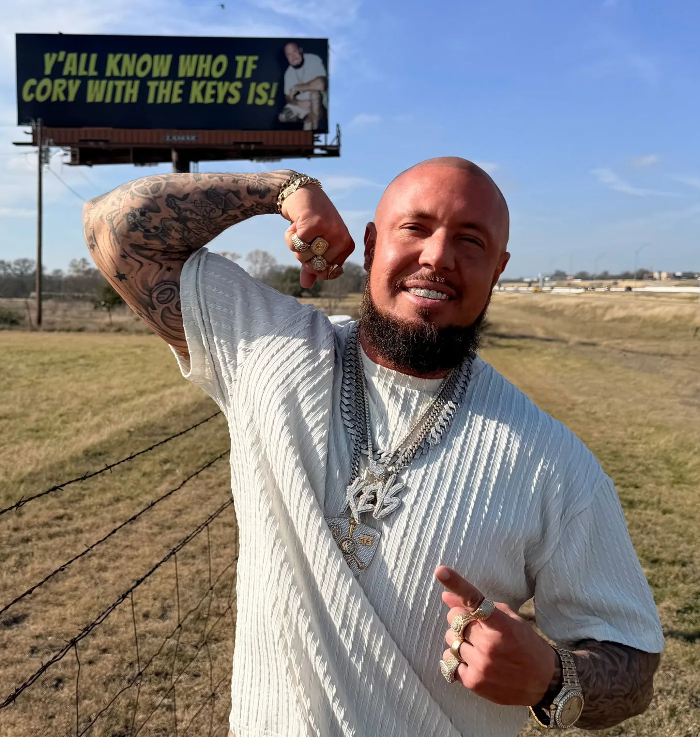 Cory with the Keys in front of his billboard: “Y'all know who TF Cory with the Keys is!”